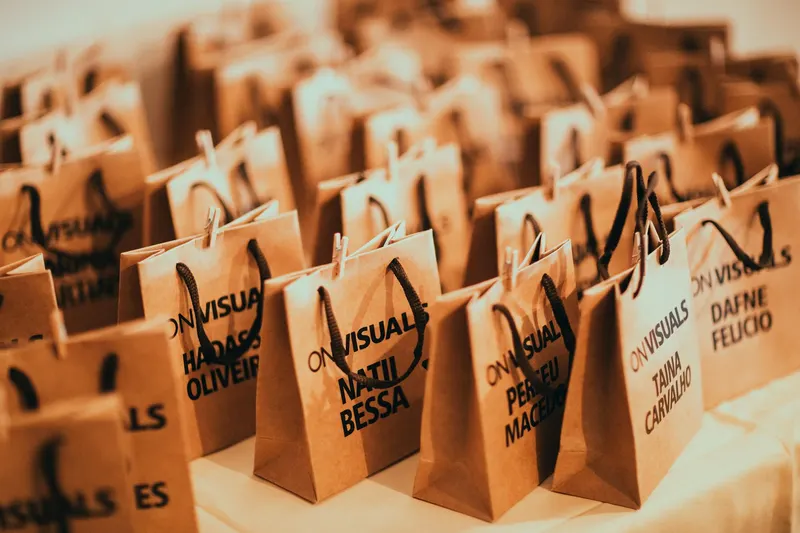 Close-up of eco-friendly paper bags with rope handles, ideal for events and packaging.